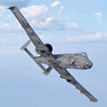 Military Fighter Jet Flying High in Blue Sky with White Clouds