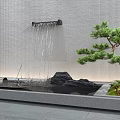 Indoor Landscape with Waterfall Wall Black Stones Pine Tree Green Plants and Gray Stone Floor