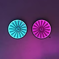 Two Round Turquoise and Pink Illuminated Wall Lamps on Purple Pink Gradient Wall