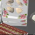 Assorted Pastries and Macarons in Decorative Boxes with Union Jack and Floral Patterns