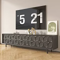 Modern Black TV Stand with Circular Pattern and Decorative Items Under Wall Mounted TV
