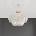 Elegant Crystal Chandelier With Glass Petals Hanging From Decorative Ceiling Against Dark Walls