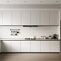 Modern Kitchen Interior With White Cabinets And Countertops Black Appliances And Utensil Hooks On Wall
