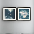Two Blue And White Abstract Landscape Paintings In Black Frames Hanging On Wall 3d model