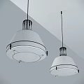 Two Modern Black Shade Pendant Lights Hanging From Ceiling With White Light