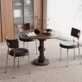 Modern Dining Area With Round Wooden Table Three Chairs Window Blinds And Potted Plant