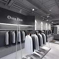 Modern Clothing Store Interior With Hanging Gray White Clothes On Display Racks And Mannequin