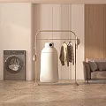 Golden Clothes Rack with Hanging Clothes and Dryer Near Washing Machine in Modern Interior