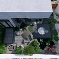 Courtyard Garden With Stone Patio Green Plants Round Table Rock Decorations And Water Feature