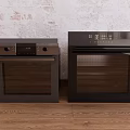 Two Black Kitchen Ovens Against Light Brick Wall And Wooden Floor