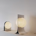 Modern Table Lamp With Spherical Glass Shade And Sleek Metal Base For Home Lighting Decor
