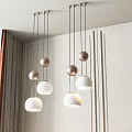 Modern Chandeliers With Hanging Metal Spheres And White Shades In Interior Design