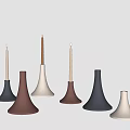 Stylish Conical Candle Holders In Gray Brown White With Lit Candles And Minimalist Design