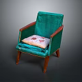 Teal Accent Chair With Wooden Armrests And Legs Featuring Decorative Cushion With Red Patterns