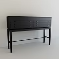 Black Console Cabinet With Multiple Drawers On Black Stand Against White Wall And Light Floor