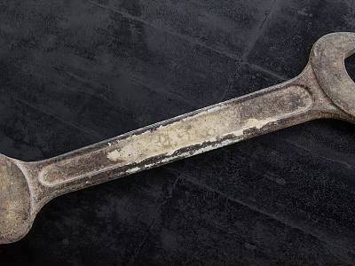 Vintage Hardware Tool Wrench on Dark Surface with Worn Metal Texture and Workshop Use 3d model