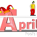 April Fool's Day Festive Display With Jester Figure Red Gift Box And Glittery April Lettering
