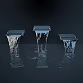 Garden Ornaments With Black Square Structures And Water Streams Falling Into Water Creating Ripples