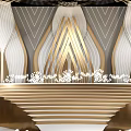 Elegant Banquet Hall With Ornate Ceiling Golden Decor Stage And Floral Arrangements