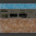 Worn Industrial Control Console With Multiple Displays Buttons And Scratched Paint On Wooden Surface