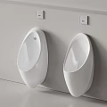Two White Wall Mounted Urinals In Modern Bathroom Interior Design