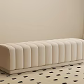 Beige Upholstered Bench with Vertical Tufted Design on Black Square Patterned Rug in Neutral Room
