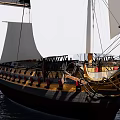 Traditional Wooden Sailing Ship Sailing On Calm Sea With White Sails And Blue Sky