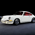 White Classic Porsche Sports Car With Red Interior Parked On Gray Floor Against Black Background