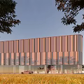 Modern Architectural Exterior With Metal Panel Facade Glass Curtain Wall Green Lawn And Trees