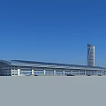 Modern Urban Architecture With Tall Glass Tower And Curved Low Rise Building Under Blue Sky