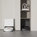 Modern Home Interior Featuring White And Black Robotic Vacuum Cleaners Beside Minimalist Cabinet
