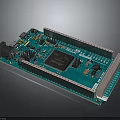 Green Microcontroller Development Board With Electronic Components Pin Headers And Chip