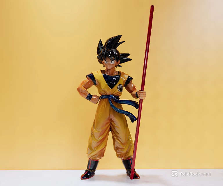 Dragon Ball Anime Character Doll With Yellow Outfit Red Staff And Black Spiky Hair 3d model 