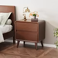 Wooden Nightstand With Two Drawers Brass Lamp Orange Flowers And Book In Bedroom
