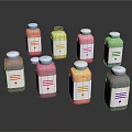 Colorful Bottled Food Drinks With White Labels And Varied Hues On Black Surface
