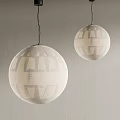 Decorative Spherical Pendant Lights With Intricate Geometric Patterns Hanging On Gray Wall