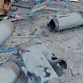 Rusted Metal Scrap Scattered With Pipes Frames And Broken Parts On Sandy Ground