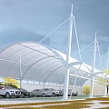 Parking Lot With White Membrane Roof And Wind Turbines Near Parked Cars