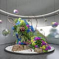 Garden Art Installation with Colorful Flowers Stones White Pebbles Hanging Spheres in Modern Indoor Space