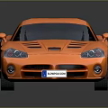 Orange Sports Car with Streamlined Body Black Roof and Shiny Wheels on Dark Background
