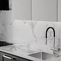 Modern Kitchen Interior Featuring Gray And Black Cabinets Marble Countertop And Appliances