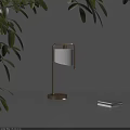 Modern Table Lamp With Golden Base White Lampshade Green Leaves Gray Tabletop And Stacked Books