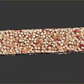 Rice Crispy Treat with Orange and Pink Sprinkles on Black Surface with Reflection