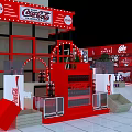 Coca Cola Display Area With Red Background Shelves Drinks Green Plants And White Chairs