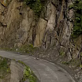 Mountain Road Infrastructure With Winding Path Rocky Cliffs Vegetation In Mountainous Area 3d model