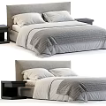Modern Double Bed With Grey White Bedding Pillows And Nightstands