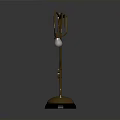 Curved Metallic Mechanical Arm With Hanging Transparent Sphere And Round Base