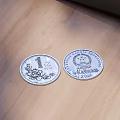 Silver Jewelry With Detailed Engraved Patterns Displayed On Wooden Table Surface