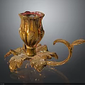Golden Carved Decorative Candle Holder With Leaf Shaped Base And Curved Handle