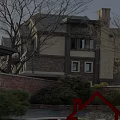Neighborhood Welcome Sign at Community Entrance with Residential Buildings and Green Landscape